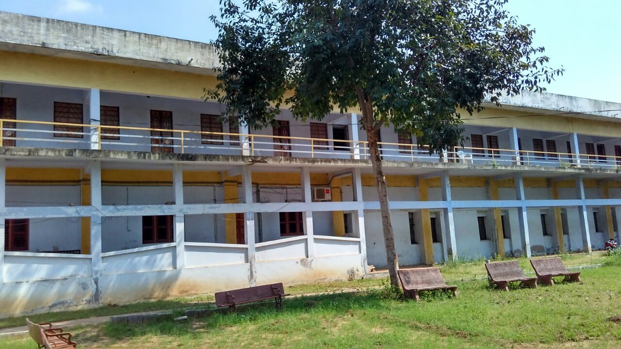 College building with lawn and seating